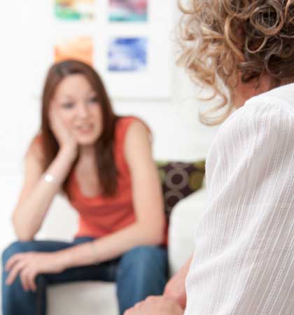 mental health worker chatting with client